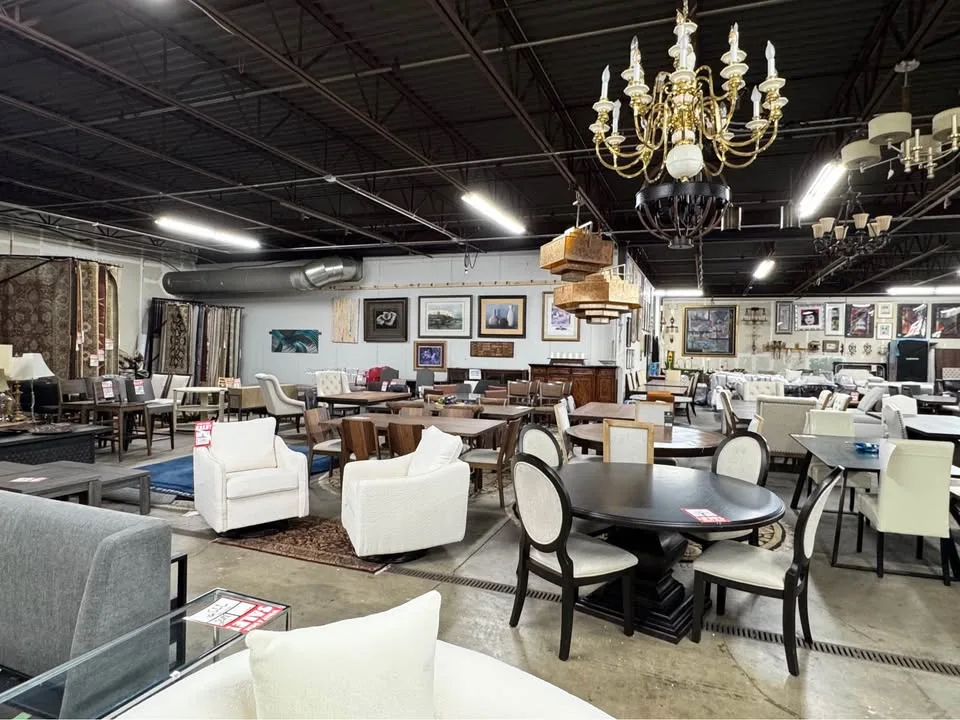 Dining room sets and hanging chandeliers in the showroom at Unique Furniture Warehouse, furniture outlet in Eden Prairie Minnesota
